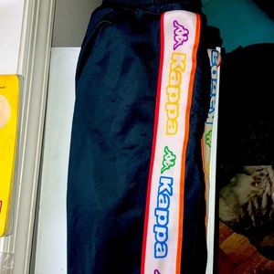 Boys kappa pants kappa black with brand colorful name down leg.